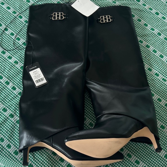 bebe Shoes - NWT Bebe Black Heeled Boots with Logo Detail. Unique with covered heel. Size 8.